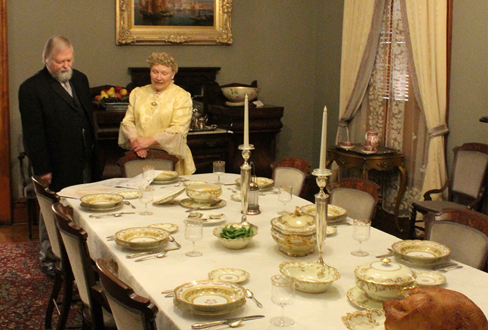 Photograph of benjamin and caroline scott harrison reenactors, in the presidential dining room.