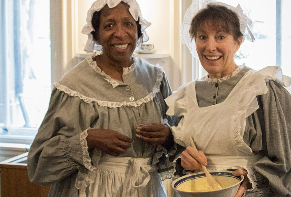 Photographic image of two women dressed as 19th century cooks.