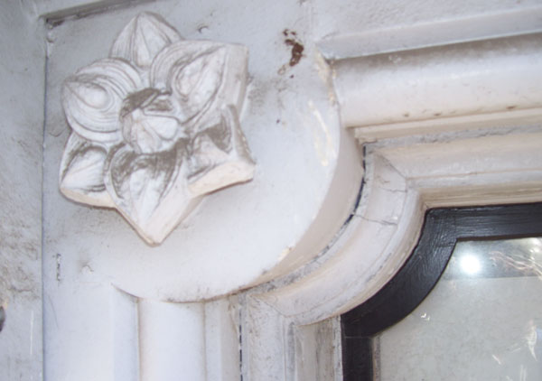 Architecture rosettes from the frieze band area of the house made of zinc. The Italianate house was built in 1874 - 1875.